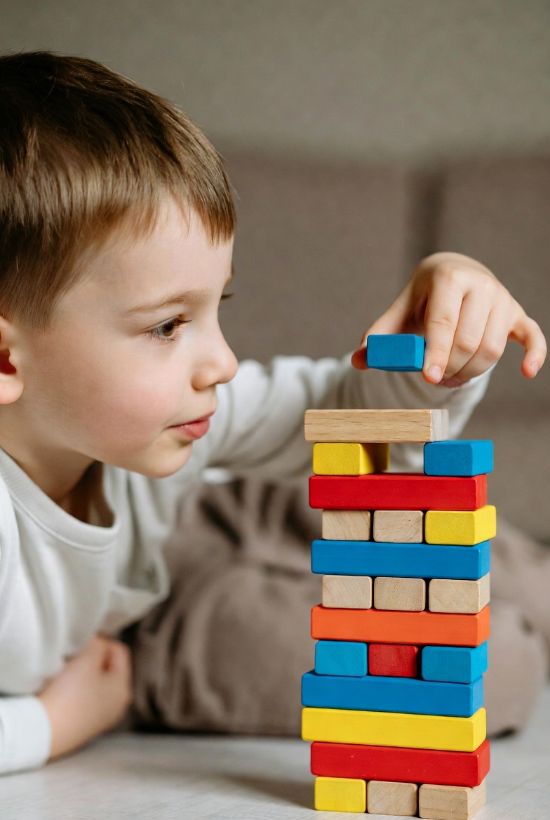 Child playing with building blocks